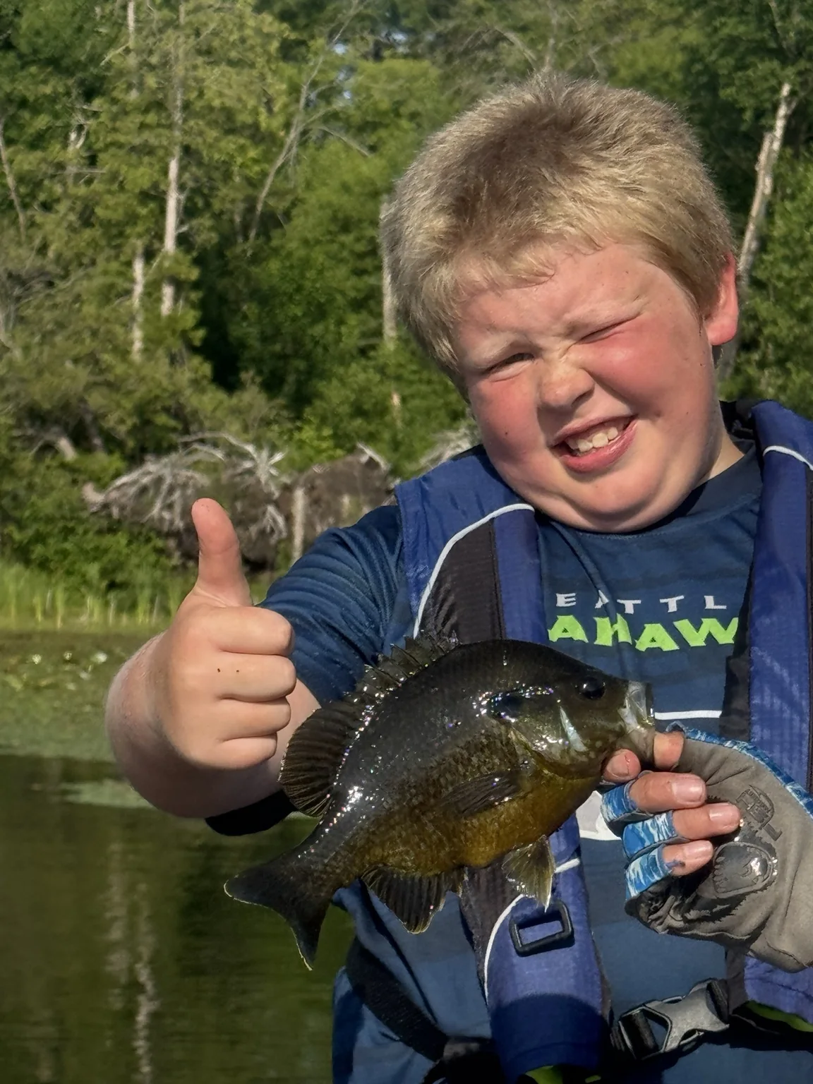 Angler holding a bluegill